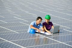 Engineers working on solar panels